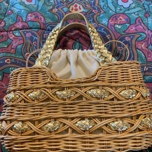 Small straw handbag with gold leather accents